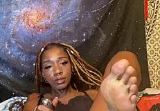 Ebony MILF smokes and flirts with body with tattoos
