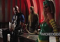 A poison ivy performs a wild threesome fuck with an ass guard