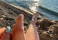 Mistress Lara a amateur milf indulges in foot fetish play on the beach