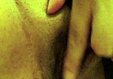 latina woman uses toys alone while partner works