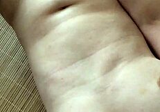 This asian milf enjoys private masturbation at home.