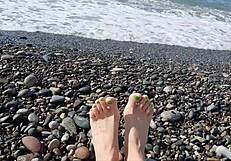 Sea-salted feet and toes of dominatrix nika licked at the beach