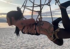 Beautiful Lari in shibari bondage at sunset, exposing her small tits and pussy