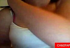 Webcam babe teases shaved pussy with solo play