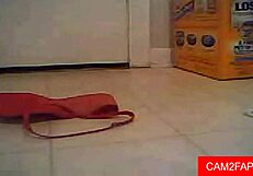 Webcam babe teases shaved pussy with solo play