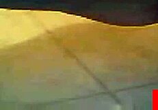 Webcam babe teases shaved pussy with solo play