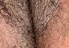 Juicy phat chocolate pussy glistens with wetness in detailed close-up