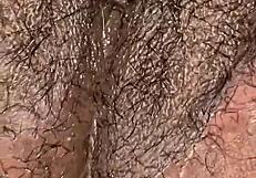 Juicy phat chocolate pussy glistens with wetness in detailed close-up