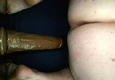 using dildo in doggy style position