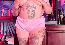 girl in silk pajamas teasing with underwear