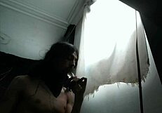 Ladyboy performs deepthroat on dildo for extended time