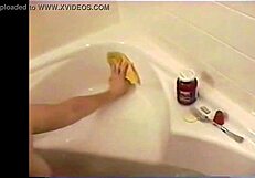 Busty brunette bathes with chocolate sauce and whipped cream on her tits