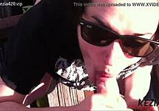 Latina brunette blows on tall bridge.