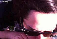 Latina brunette blows on tall bridge.