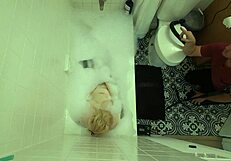 annie archer in the shower with hanging bag