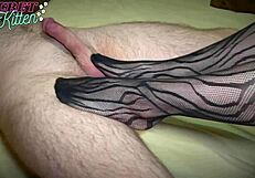 Hot girl in black stockings gives intense footjob to cock