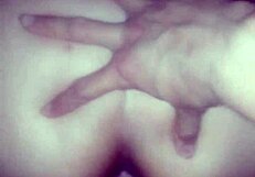 The couple enjoys anal doggystyle, bent over, leading to orgasm in her ass.