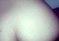 The couple enjoys anal doggystyle, bent over, leading to orgasm in her ass.