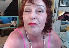 dawnskye, the redhead, shows off her silly yet sensual side in a black lace dress. revealing her porcelain white skin and old boobs