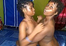 Hey, these black teen lesbians are kissing and fingering each other's boobs,