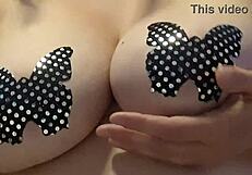 In this casual story, she teases her big natural tits while masturbating