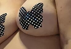 In this casual story, she teases her big natural tits while masturbating