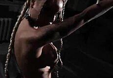 Russian Pornstar Monika Fox Poses as BDSM Slave Tied with Ropes, Displaying Pierced Nipples and Fake Tits