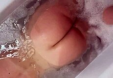 BBW Busty blonde has fun in the process of washing herself having big tits and big ass