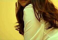 Busty Japanese woman dances seductively while showing off her panties