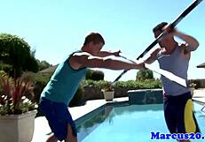 Hey! Watch gay muscular jocks sword fighting poolside!