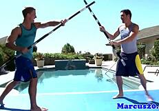 Hey! Watch gay muscular jocks sword fighting poolside!