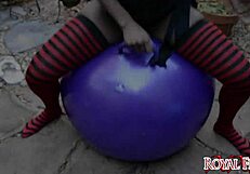 Ebony exotic babe bounces on balloon fetish.