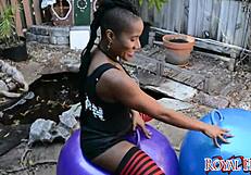 Ebony exotic babe bounces on balloon fetish.