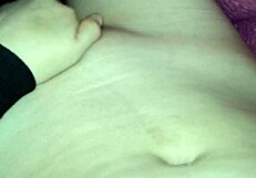 Hot gay stands naked in front of the bed and masturbates only to ejaculate on chest