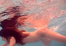 Still and slender European brunette Natalia Kupalka takes a bath naked