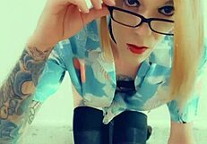 Feminized transsexual pornstar kneels in stockings and lingerie, eagerly sucking cock during interview.