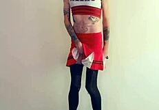 Feminized transsexual pornstar kneels in stockings and lingerie, eagerly sucking cock during interview.