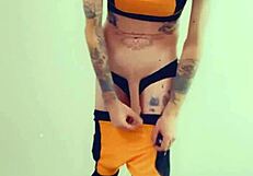 Feminized transsexual pornstar kneels in stockings and lingerie, eagerly sucking cock during interview.