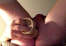 she stretches her ass with a huge dildo, fucking it deep