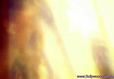 erotic brunette indian dancer lover from the orient performs teasing striptease undressing nude.