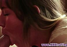 Watch this petite teen sucking that huge cock? It's incredible!