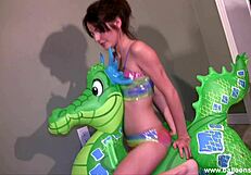 lola experiences overwhelming pleasure humping and taming the green dragon in bikini by the pool.