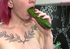 olivia teases with cucumber in kitchen, leading to blowjob