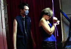 Nyx endures tickling in corset bondage