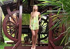 Blonde teen undressing in a short sun dress. Enjoying the bower's calm vibe.