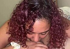 A gorgeous black lady performs cervical on a white man