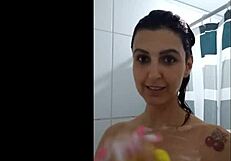 Big tit beauty gets some fun in the shower with her big tits