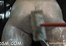 Shackled beauty gets punished in a dark garage setting