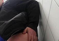Gay chubby man masturbates in a public toilet