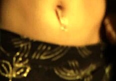 Indian brunette dances seductively while undressing and teasing.